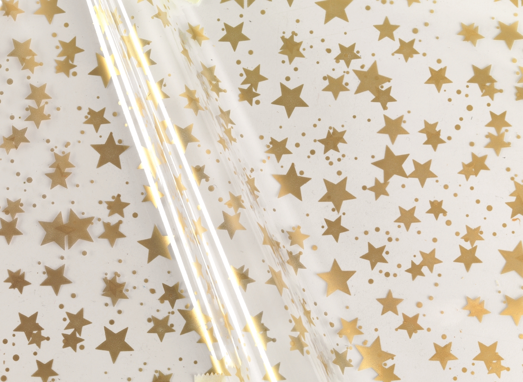 Afbeeldingen van Rol Kerstfolie 60 cm 300 mtr 30 my sterren goud